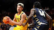 Nov 6, 2024; Minneapolis, Minnesota, USA; Minnesota Golden Gophers forward Dawson Garcia (3) works around Oral Roberts Golden Eagles forward Sam Alajiki (64) during the first half at Williams Arena. Mandatory Credit: Matt Krohn-Imagn Images