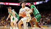 Nov 13, 2024; Minneapolis, Minnesota, USA; Minnesota Golden Gophers guard Lu'Cye Patterson (25) dribbles as North Texas Mean Green guard Jasper Floyd (3) defends during the first half at Williams Arena. Mandatory Credit: Matt Krohn-Imagn Images