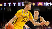 Minnesota guard Brennan Rigsby (24) works around Yale guard John Poulakidas during the first half at Williams Arena in Minneapolis on Nov. 16, 2024. 