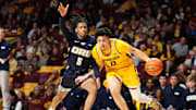 Minnesota guard Mike Mitchell Jr. works around Oral Roberts  guard Darius Robinson Jr. (5) during the first half at Williams Arena in Minneapolis on Nov. 6, 2024.