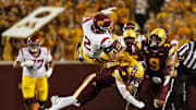 Oct 5, 2024; Minneapolis, Minnesota, USA; Minnesota Golden Gophers defensive back Koi Perich (3) tackles USC Trojans wide receiver Duce Robinson (2) during the second half at Huntington Bank Stadium. Mandatory Credit: Matt Krohn-Imagn Images