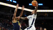 Penn State Nittany Lions guard Ace Baldwin Jr. shoots as Michigan Wolverines guard Jace Howard defends during a Big Ten Conference game. 