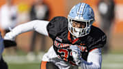 Jan 31, 2024; Mobile, AL, USA; National linebacker Cedric Gray of North Carolina (33) works in coverage during practice for the National team at Hancock Whitney Stadium. Mandatory Credit: Vasha Hunt-Imagn Images