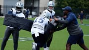 Jun 5, 2024; Frisco, TX, USA;  Dallas Cowboys running back Ezekiel Elliott (15) goes through a drill during practice at the Ford Center at the Star Training Facility in Frisco, Texas. Mandatory Credit: Chris Jones-USA TODAY Sports