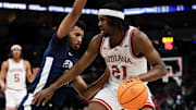Indiana forward Mackenzie Mgbako (21) dribbles as Penn State Nittany Lions forward Zach Hicks (24) defends last year.