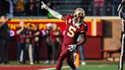 Nov 4, 2023; Minneapolis, Minnesota, USA; Minnesota Golden Gophers defensive back Justin Walley (5) celebrates a fumble recovery by defensive lineman Chris Collins (13) during the second half against the Illinois Fighting Illini at Huntington Bank Stadium. Mandatory Credit: Matt Krohn-Imagn Images