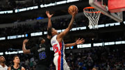 Apr 12, 2024; Dallas, Texas, USA; Detroit Pistons guard Marcus Sasser (25) scores a layup against Dallas Mavericks forward Olivier-Maxence Prosper (18) during the second half at American Airlines Center. Mandatory Credit: Chris Jones-USA TODAY Sports
