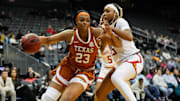 Jan 20, 2025; Newark, New Jersey, USA; Texas Longhorns forward Aaliyah Moore (23) drives to the basket against Maryland Terrapins forward Christina Dalce (15) during the second half at Prudential Center. Mandatory Credit: Chris Jones-Imagn Images