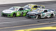 Oct 6, 2024; Talladega, Alabama, USA; Ricky Stenhouse, Jr. (47) battles Brad Keselowski (6) on the final overtime lap of the YellaWood 500 at Talladega Superspeedway.