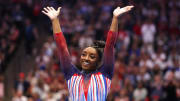 Jun 30, 2024; Minneapolis, Minnesota, USA; Simone Biles celebrates her floor routine during the U.S. Olympic Team Gymnastics Trials at Target Center. 