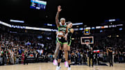 Minnesota Lynx guard Courtney Williams and forward Napheesa Collier celebrate their team's win after Game 5 of the 2024 WNBA Semifinals against the Connecticut Sun at Target Center. Mandatory Credit: Matt Krohn-Imagn Images