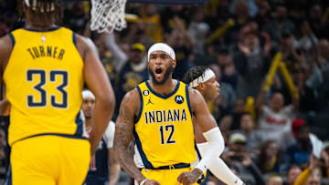 Dec 9, 2022; Indianapolis, Indiana, USA; Indiana Pacers forward Oshae Brissett (12) celebrates a basket in the second half against the Washington Wizards at Gainbridge Fieldhouse. Mandatory Credit: Trevor Ruszkowski-Imagn Images