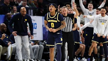 Mar 13, 2024; Minneapolis, MN, USA; Michigan Wolverines guard Dug McDaniel (0) celebrates his