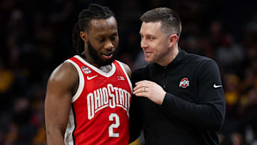 Mar 14, 2024; Minneapolis, MN, USA; Ohio State Buckeyes interim head coach Jake Diebler talks to guard Bruce Thornton (2) during the second half against the Iowa Hawkeyes at Target Center. Mandatory Credit: Matt Krohn-Imagn Images