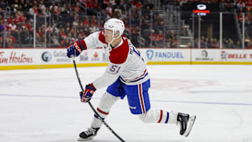 Dec 20, 2024; Detroit, Michigan, USA; Montreal Canadiens left wing Emil Heineman (51) shoots the puck for a goal in the first period against the Detroit Red Wings at Little Caesars Arena. Mandatory Credit: Brian Bradshaw Sevald-Imagn Images