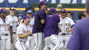 May 25, 2024; Hoover, AL, USA; LSU Tigers players cheer as their head coach Jay Johnson returns to the field after his ejection to celebrates with them postgame following a 12-11 tenth inning walkoff win over the South Carolina Gamecocks during the SEC Baseball Tournament at Hoover Metropolitan Stadium. Mandatory Credit: Vasha Hunt-USA TODAY Sports