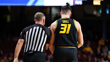 Nov 16, 2023; Minneapolis, Minnesota, USA; Missouri Tigers guard Caleb Grill (31) reacts after being charged with a technical foul against the Minnesota Golden Gophers during the second half at Williams Arena. After the initial reaction he received another technical and was ejected from the game. Mandatory Credit: Matt Krohn-Imagn Images