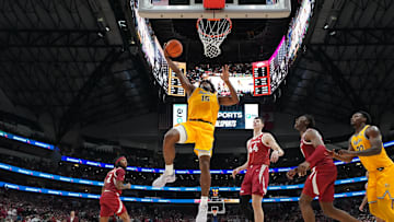 Nov 9, 2024; Dallas, Texas, USA; Baylor Bears forward Norchad Omier (15) scores a basket ahead of Arkansas Razorbacks forward Zvonimir Ivisic (44)  during the second half at American Airlines Center. Mandatory Credit: Chris Jones-Imagn Images