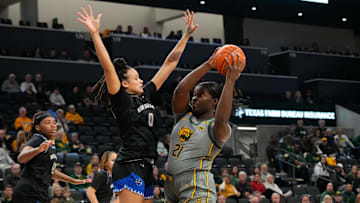 Nov 29, 2024; Waco, Texas, USA;  Baylor Lady Bears center Aaronette Vonleh (21) looks to score against New Orleans Privateers center Nora Francois (0) during the first half at Ferrell Center. Mandatory Credit: Chris Jones-Imagn Images