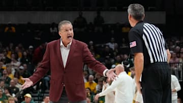 Nov 9, 2024; Dallas, Texas, USA;  Arkansas Razorbacks head coach John Calipari argues with an official during a break in play against the Baylor Bears during the first half at American Airlines Center. Mandatory Credit: Chris Jones-Imagn Images