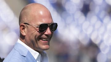 Sep 15, 2024; Baltimore, Maryland, USA;  Baltimore Ravens general manager Eric DeCosta walks across the field before the game against the Las Vegas Raiders at M&T Bank Stadium. Mandatory Credit: Tommy Gilligan-Imagn Images