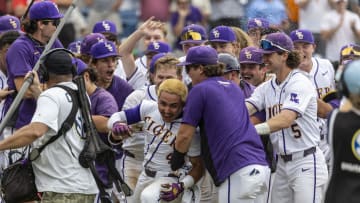 May 25, 2024; Hoover, AL, USA; LSU Tigers infielder Steven Milam (4) celebrates with his teammates after his walkoff home run against the South Carolina Gamecocks during the SEC Baseball Tournament at Hoover Metropolitan Stadium. Mandatory Credit: Vasha Hunt-USA TODAY Sports