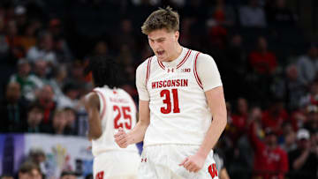 Mar 14, 2024; Minneapolis, MN, USA; Wisconsin Badgers forward Nolan Winter (31) celebrates his basket against the Maryland Terrapins during the first half at Target Center. Mandatory Credit: Matt Krohn-Imagn Images