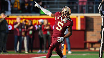 Minnesota Golden Gophers defensive back Justin Walley (5) celebrates a fumble recovery by defensive lineman Chris Collins (13) during the second half against the Illinois Fighting Illini at Huntington Bank Stadium.