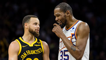 Feb 10, 2024; San Francisco, California, USA; Golden State Warriors guard Stephen Curry (30) and Phoenix Suns forward Kevin Durant (35) talk during the second half at Chase Center. Mandatory Credit: John Hefti-Imagn Images
