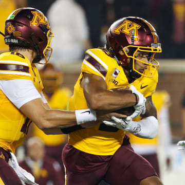 Aug 29, 2024; Minneapolis, Minnesota, USA; Minnesota Golden Gophers quarterback Max Brosmer (16) hands the ball off to wide receiver Daniel Jackson (9) during the first half against the North Carolina Tar Heels at Huntington Bank Stadium. Mandatory Credit: Matt Krohn-USA TODAY Sports