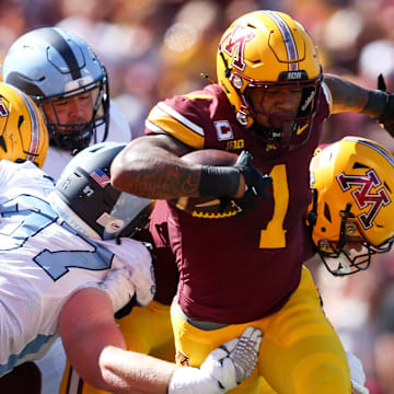 Sep 7, 2024; Minneapolis, Minnesota, USA; Minnesota Golden Gophers running back Darius Taylor (1) runs for a touchdown against the Rhode Island Rams during the first half at Huntington Bank Stadium. Mandatory Credit: Matt Krohn-Imagn Images