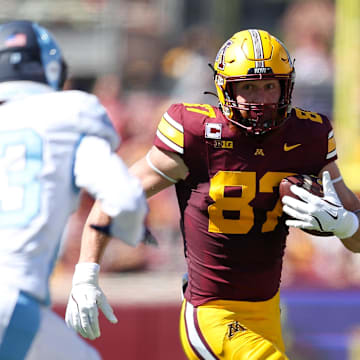 Sep 7, 2024; Minneapolis, Minnesota, USA; Minnesota Golden Gophers tight end Nick Kallerup (87) runs with the ball after making a catch against the Rhode Island Rams during the first half at Huntington Bank Stadium. Mandatory Credit: Matt Krohn-Imagn Images