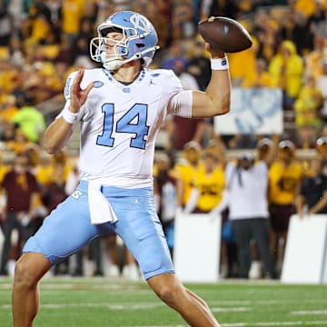 Aug 29, 2024; Minneapolis, Minnesota, USA; North Carolina Tar Heels quarterback Max Johnson (14) throws the ball against the Minnesota Golden Gophers during the first half at Huntington Bank Stadium. 