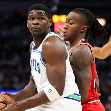 Mar 31, 2024; Minneapolis, Minnesota, USA; Minnesota Timberwolves guard Anthony Edwards (5) works around Chicago Bulls guard Ayo Dosunmu (12) during the first half at Target Center. Mandatory Credit: Matt Krohn-Imagn Images