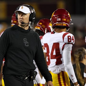 Oct 5, 2024; Minneapolis, Minnesota, USA; USC Trojans head coach Lincoln Riley looks on during the first half against the Minnesota Golden Gophers at Huntington Bank Stadium. Mandatory Credit: Matt Krohn-Imagn Images