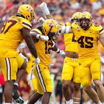 Minnesota Golden Gophers defensive back Darius Green (12) celebrates his tackle 