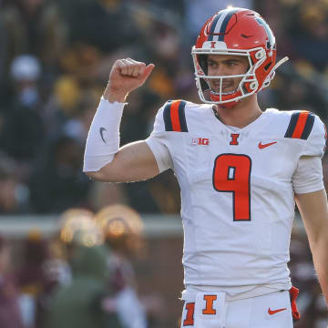 Nov 4, 2023; Minneapolis, Minnesota, USA; Illinois Fighting Illini quarterback Luke Altmyer (9) celebrates his touchdown pass to wide receiver Isaiah Williams (1) during the first half against the Minnesota Golden Gophers at Huntington Bank Stadium. Mandatory Credit: Matt Krohn-USA TODAY Sports