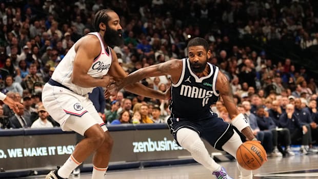 Dallas Mavericks guard Kyrie Irving (11) drives to the basket as LA Clippers guard James Harden Dallas Mavericks guard Kyrie Irving (11) drives to the basket as LA Clippers guard James Harden