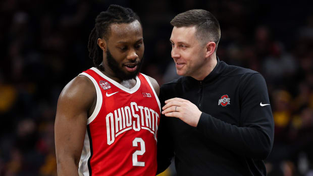Mar 14, 2024; Minneapolis, MN, USA; Ohio State Buckeyes interim head coach Jake Diebler talks to guard Bruce Thornton (2) during the second half against the Iowa Hawkeyes at Target Center. Mandatory Credit: Matt Krohn-USA TODAY Sports