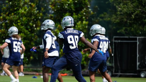 Dallas Cowboys defensive end DeMarcus Lawrence Elliott (90) goes through a drill during practice at the Ford Center at the St