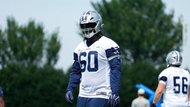 Dallas Cowboys tackle Tyler Guyton (60) goes through a drill during practice at the Ford Center