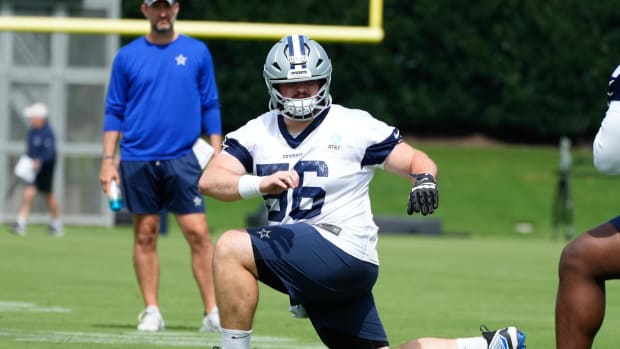 Dallas Cowboys center Cooper Beebe (56) goes through a drill during practice at the Ford Center