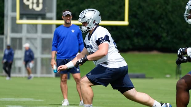 Dallas Cowboys center Cooper Beebe (56) goes through a drill during practice at the Ford Cente