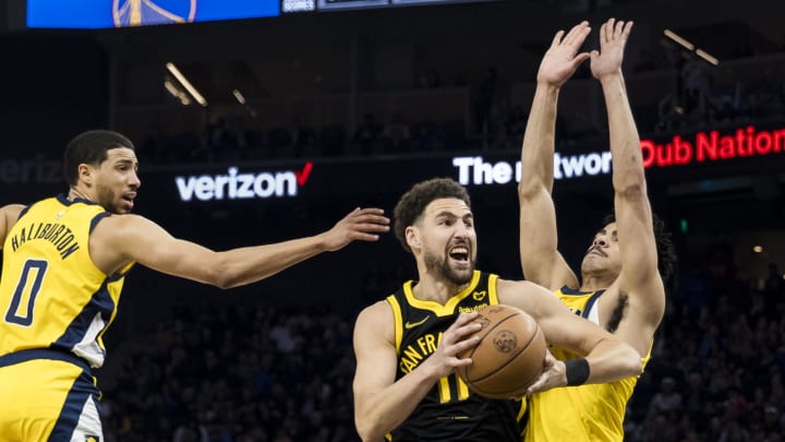 Mar 22, 2024; San Francisco, California, USA; Indiana Pacers guard Ben Sheppard (26) and guard Tyrese Haliburton (0) guard Golden State Warriors guard Klay Thompson (11) during the first half at Chase Center. Mandatory Credit: John Hefti-USA TODAY Sports