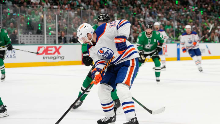 May 31, 2024; Dallas, Texas, USA; Edmonton Oilers left wing Zach Hyman (18) skates with the puck as Dallas Stars center Tyler Seguin (91) defends during the first period between the Dallas Stars and the Edmonton Oilers in game five of the Western Conference Final of the 2024 Stanley Cup Playoffs at American Airlines Center. Mandatory Credit: Chris Jones-USA TODAY Sports