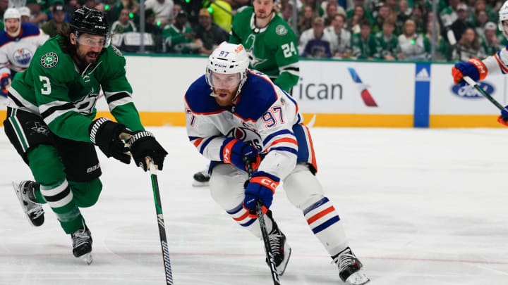 May 31, 2024; Dallas, Texas, USA; Edmonton Oilers center Connor McDavid (97) skates with the puck as Dallas Stars defenseman Chris Tanev (3) defends during the first period between the Dallas Stars and the Edmonton Oilers in game five of the Western Conference Final of the 2024 Stanley Cup Playoffs at American Airlines Center. Mandatory Credit: Chris Jones-USA TODAY Sports