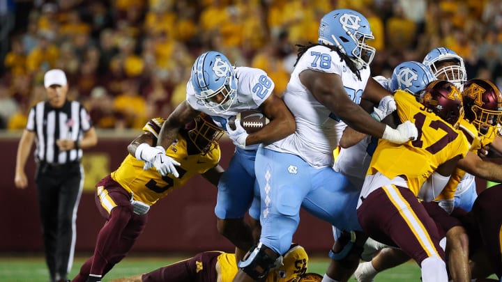 Aug 29, 2024; Minneapolis, Minnesota, USA; North Carolina Tar Heels running back Omarion Hampton (28) runs the ball against the Minnesota Golden Gophers during the first half at Huntington Bank Stadium. Mandatory Credit: Matt Krohn-USA TODAY Sports