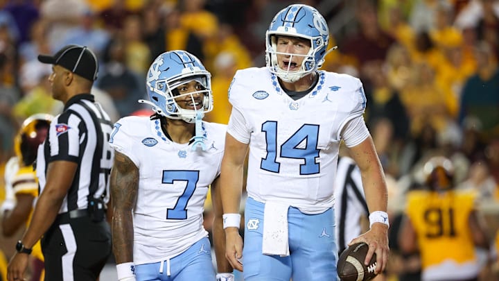 Aug 29, 2024; Minneapolis, Minnesota, USA; North Carolina Tar Heels quarterback Max Johnson (14) celebrates his rushing touchdown against the Minnesota Golden Gophers during the first half at Huntington Bank Stadium. Mandatory Credit: Matt Krohn-Imagn Images