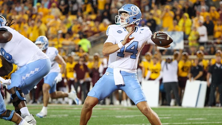 Aug 29, 2024; Minneapolis, Minnesota, USA; North Carolina Tar Heels quarterback Max Johnson (14) throws the ball against the Minnesota Golden Gophers during the first half at Huntington Bank Stadium. Mandatory Credit: Matt Krohn-Imagn Images