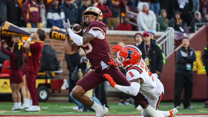 Minnesota wide receiver Daniel Jackson (9) makes a touchdown catch while Illinois defensive back Tahveon Nicholson (3) defends during the second half at Huntington Bank Stadium in Minneapolis on Nov. 4, 2023.